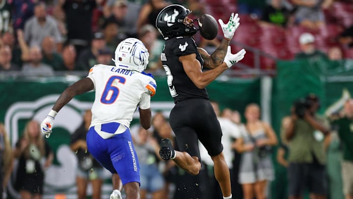 South Florida receiver Chas Nimrod catches a pass in front of Boise State's Jeremiah Earby. South Florida receiver Chas Nimrod catches a pass in front of Boise State's Jeremiah Earby.