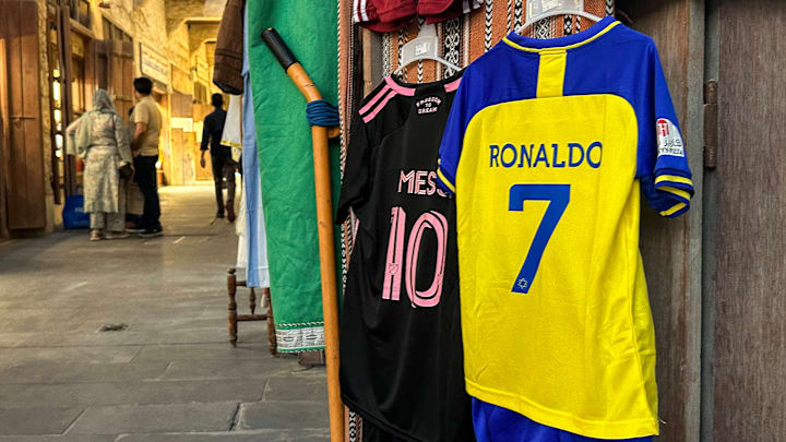 QATAR-FBL-MESSI-RONALDO