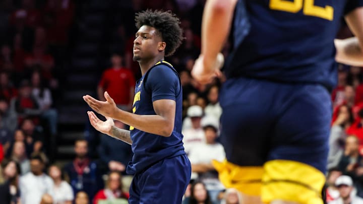 Jan 24, 2026; Tucson, Arizona, USA; The West Virginia Mountaineers celebrates a three-point basket during the first half of the game against the Arizona Wildcats at McKale Memorial Center. Mandatory Credit: Aryanna Frank-Imagn Images