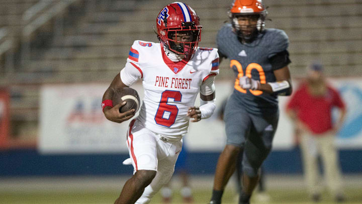 Pine Forest running back Zion Legree (No. 6) slips past the Escambia defense during their district battle.