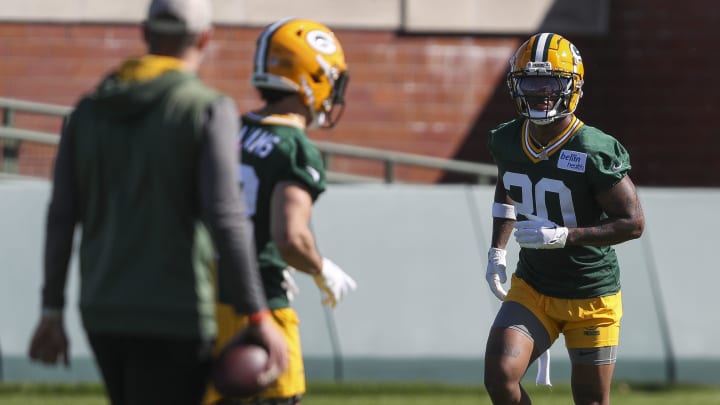 Green Bay Packers safety Javon Bullard (20) runs through drills during offseason practices.