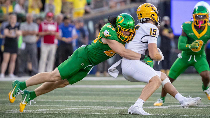 Idaho receiver Mark Hamper is tackled during a game against Oregon