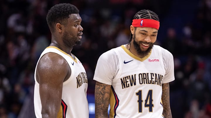 Dec 31, 2023; New Orleans, Louisiana, USA;  New Orleans Pelicans forward Zion Williamson (1) and forward Brandon Ingram (14) share a laugh after a play against the Los Angeles Lakers during the second half at Smoothie King Center. Mandatory Credit: Stephen Lew-Imagn Images