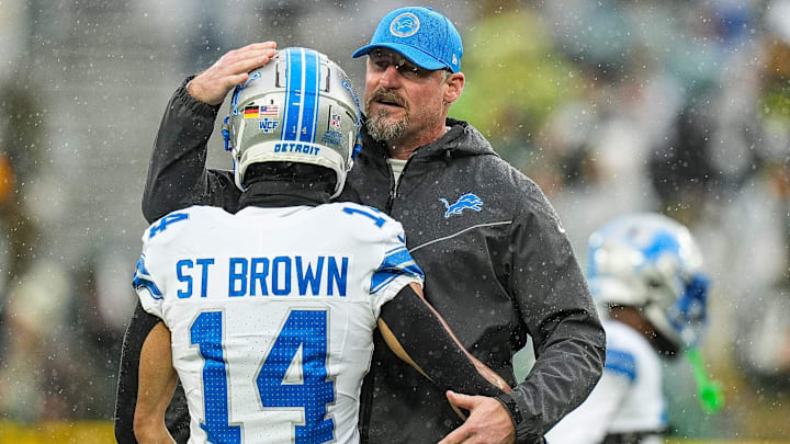 Detroit Lions head coach Dan Campbell hugs wide receiver Amon-Ra St. Brown (14) during warm up before the Green Bay Packers game at Lambeau Field in Green Bay, Wis. on Sunday, Nov. 3, 2024.