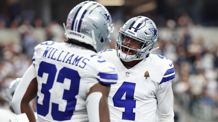 Dallas Cowboys running back Javonte Williams (33) celebrates with quarterback Dak Prescott (4) after scoring a touchdown against the New York Giants during the third quarter at AT&T Stadium. Mandatory Credit: Kevin Jairaj-Imagn Images