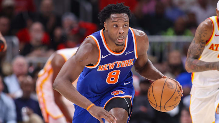 New York Knicks forward Og Anunoby (8) dribbles against the Atlanta Hawks in the second quarter during game six of the first round of the 2026 NBA Playoffs at State Farm Arena.