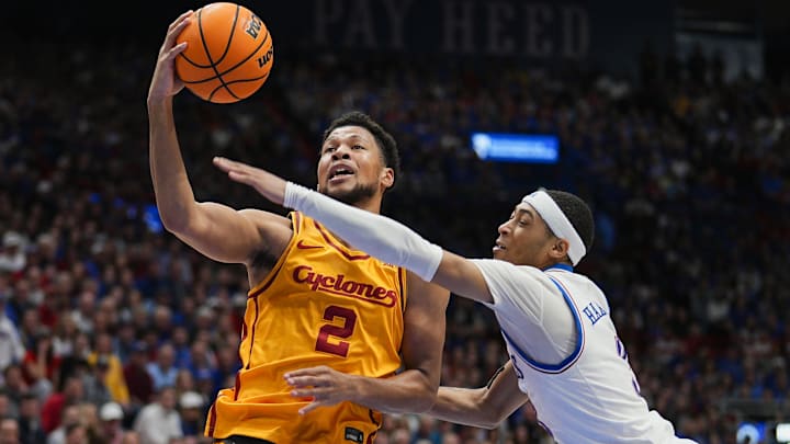 Feb 3, 2025; Lawrence, Kansas, USA; Iowa State Cyclones forward Joshua Jefferson (2) shoots against Kansas Jayhawks guard Dajuan Harris Jr. (3) during the first half at Allen Fieldhouse.