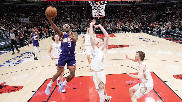 Feb 22, 2025; Chicago, Illinois, USA; Chicago Bulls guard Kevin Huerter (13) defends Phoenix Suns guard Bradley Beal (3) during the second half at United Center. Mandatory Credit: David Banks-Imagn Images