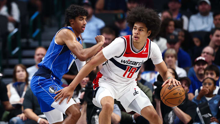 Oct 24, 2025; Dallas, Texas, USA; Washington Wizards forward Kyshawn George (18) dribbles as Dallas Mavericks guard Max Christie (00) defends during the first quarter at American Airlines Center. Mandatory Credit: Kevin Jairaj-Imagn Images Oct 24, 2025; Dallas, Texas, USA; Washington Wizards forward Kyshawn George (18) dribbles as Dallas Mavericks guard Max Christie (00) defends during the first quarter at American Airlines Center. Mandatory Credit: Kevin Jairaj-Imagn Images