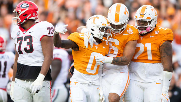 Tennessee defensive back Doneiko Slaughter (0), Tennessee linebacker Aaron Beasley (6) and Tennessee defensive lineman Omari Thomas (21) celebrate during a football game between Tennessee and Georgia at Neyland Stadium in Knoxville, Tenn., on Saturday, Nov. 18, 2023.