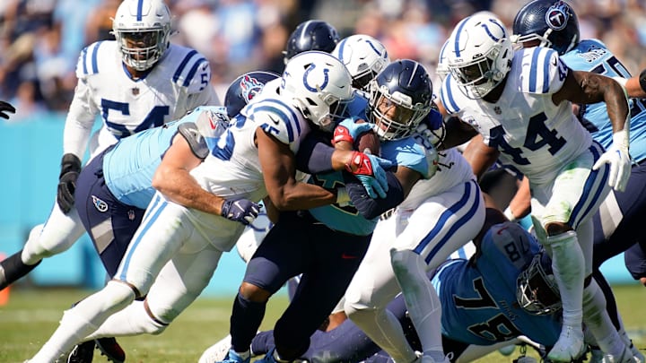 Tennessee Titans running back Derrick Henry (22) is tackled by Indianapolis Colts linebacker E.J.
