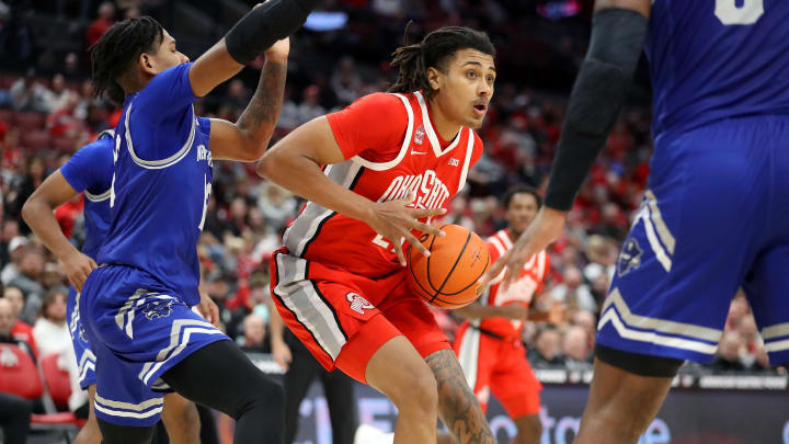 Dec 21, 2023; Columbus, Ohio, USA; Ohio State Buckeyes forward Devin Royal (21) looks to pass as New Orleans Privateers guard Jamond Vincent (13) defends during the second half at Value City Arena. Mandatory Credit: Joseph Maiorana-USA TODAY Sports Dec 21, 2023; Columbus, Ohio, USA; Ohio State Buckeyes forward Devin Royal (21) looks to pass as New Orleans Privateers guard Jamond Vincent (13) defends during the second half at Value City Arena. Mandatory Credit: Joseph Maiorana-USA TODAY Sports