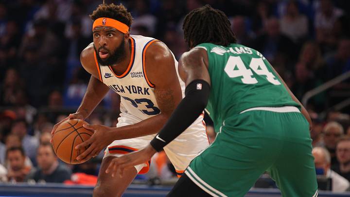 Oct 20, 2021; New York, New York, USA; New York Knicks center Mitchell Robinson (23) controls the ball against Boston Celtics center Robert Williams III (44) during the first quarter at Madison Square Garden. Mandatory Credit: Brad Penner-USA TODAY Sports Oct 20, 2021; New York, New York, USA; New York Knicks center Mitchell Robinson (23) controls the ball against Boston Celtics center Robert Williams III (44) during the first quarter at Madison Square Garden. Mandatory Credit: Brad Penner-USA TODAY Sports