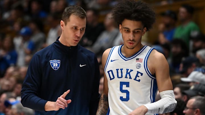 Duke basketball head coach Jon Scheyer and guard Tyrese Proctor