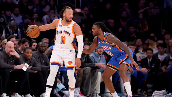 Jan 10, 2025; New York, New York, USA; New York Knicks guard Jalen Brunson (11) controls the ball against Oklahoma City Thunder guard Cason Wallace (22) during the first quarter at Madison Square Garden. Mandatory Credit: Brad Penner-Imagn Images