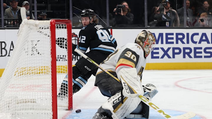 Nov 24, 2025; Salt Lake City, Utah, USA; Utah Mammoth center Logan Cooley (92) looks back to watch the puck go in the net past Vegas Golden Knights goaltender Carl Lindbom (30) during the third period at Delta Center. Mandatory Credit: Rob Gray-Imagn Images