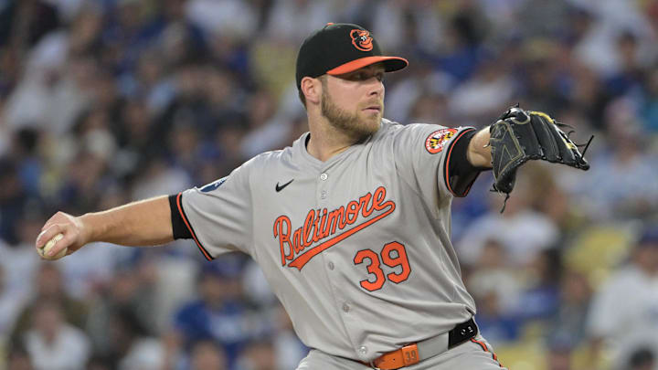 Aug 28, 2024; Los Angeles, California, USA;  Baltimore Orioles starting pitcher Corbin Burnes (39) delivers to the plate in the first inning against the Los Angeles Dodgers at Dodger Stadium. Mandatory Credit: Jayne Kamin-Oncea-Imagn Images