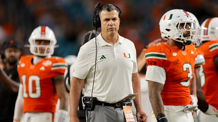 Nov 15, 2025; Miami Gardens, Florida, USA; Miami Hurricanes head coach Mario Cristobal watches from the sideline against NC State Wolfpack during the third quarter at Hard Rock Stadium. Mandatory Credit: Sam Navarro-Imagn Images Nov 15, 2025; Miami Gardens, Florida, USA; Miami Hurricanes head coach Mario Cristobal watches from the sideline against NC State Wolfpack during the third quarter at Hard Rock Stadium. Mandatory Credit: Sam Navarro-Imagn Images