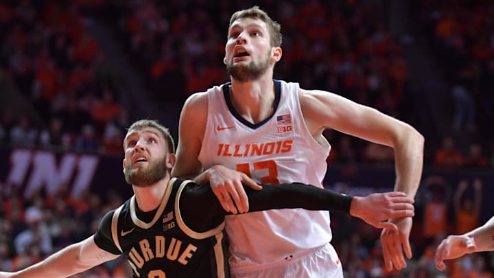 Mar 7, 2025; Champaign, Illinois, USA;  Purdue Boilermakers guard Braden Smith (3) and Illinois Fighting Illini center Tomislav Ivisic (13) battle for position during the first half at State Farm Center. Mandatory Credit: Ron Johnson-Imagn Images