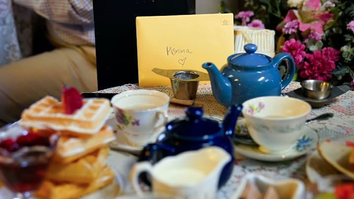 A Mother's Day card sits at the table 