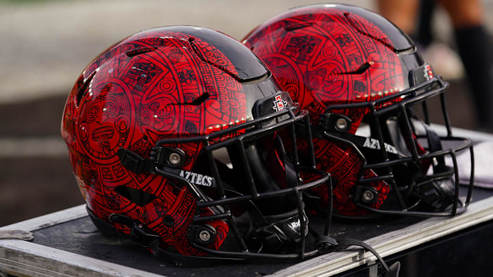Oct 12, 2024; Laramie, Wyoming, USA; A general view of San Diego State Aztecs helmets against the Wyoming Cowboys during the fourth quarter at Jonah Field at War Memorial Stadium. Mandatory Credit: Troy Babbitt-Imagn Images Oct 12, 2024; Laramie, Wyoming, USA; A general view of San Diego State Aztecs helmets against the Wyoming Cowboys during the fourth quarter at Jonah Field at War Memorial Stadium. Mandatory Credit: Troy Babbitt-Imagn Images