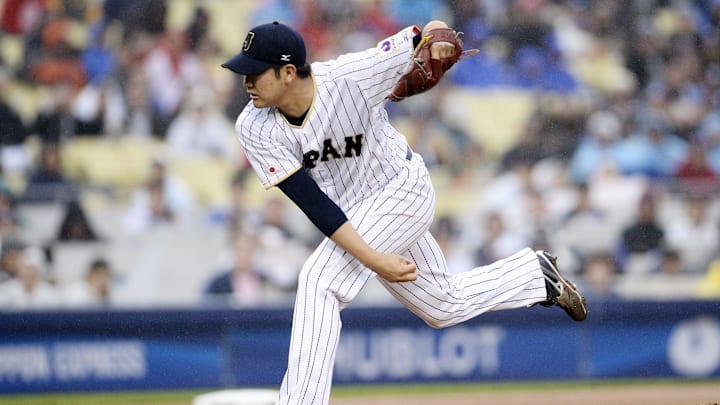 March 21, 2017; Los Angeles, CA, USA; Japan pitcher Tomoyuki Sugano (11) throws against USA in the first  inning during the 2017 World Baseball Classic at Dodger Stadium. 