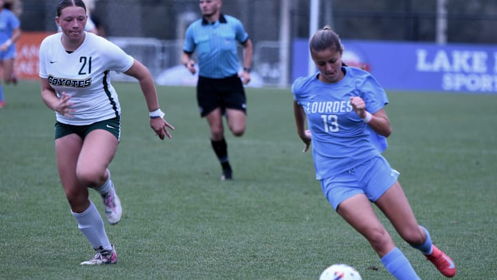 Lourdes Academy sophomore forward Veronica Aguilar brings the ball deep into Wesley Chapel Cypress Creek territory during a Class 5A girls soccer semifinal on Wednesday at Lake Myrtle Park in Auburndale. Lourdes Academy sophomore forward Veronica Aguilar brings the ball deep into Wesley Chapel Cypress Creek territory during a Class 5A girls soccer semifinal on Wednesday at Lake Myrtle Park in Auburndale.
