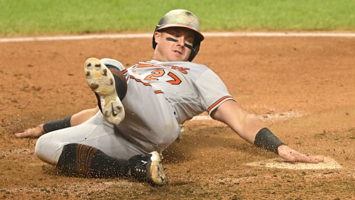 Sep 23, 2023; Cleveland, Ohio, USA; Baltimore Orioles catcher James McCann (27) scores in the sixth