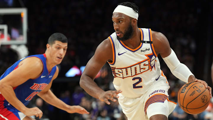 Oct 11, 2024; Phoenix, Arizona, USA; Phoenix Suns forward Josh Okogie (2) dribbles by Detroit Pistons guard Dereon Seabron (18) during the first half at Footprint Center. Mandatory Credit: Joe Camporeale-Imagn Images