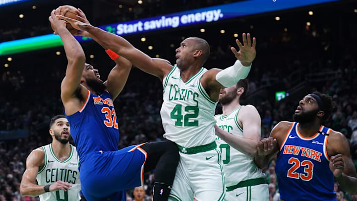 May 5, 2025; Boston, Massachusetts, USA; New York Knicks center Karl-Anthony Towns (32) shoots the ball against Boston Celtics center Al Horford (42) in the first quarter during game one of the second round for the 2025 NBA Playoffs at TD Garden. Mandatory Credit: David Butler II-Imagn Images