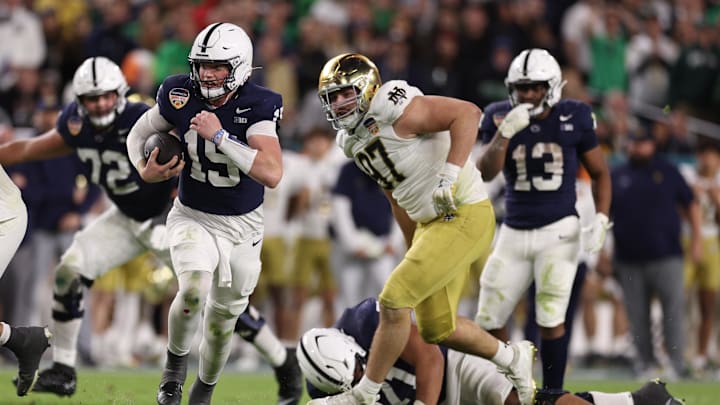 Penn State Nittany Lions quarterback Drew Allar runs the ball in the second half against the Notre Dame Fighting Irish in the Orange Bowl at Hard Rock Stadium. 