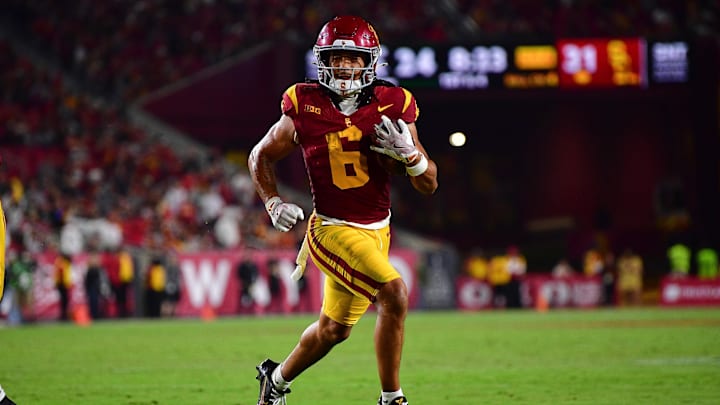 Sep 20, 2025; Los Angeles, California, USA; Southern California Trojans wide receiver Makai Lemon (6) runs for a touchdown against the Michigan State Spartans during the second half at the Los Angeles Memorial Coliseum. Mandatory Credit: Gary A. Vasquez-Imagn Images