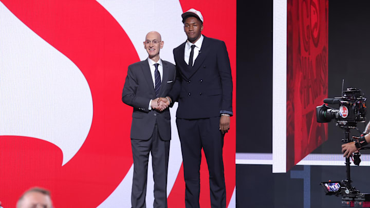 Jun 25, 2025; Brooklyn, NY, USA;  Derik Queen stands with NBA commissioner Adam Silver after being selected as the 13th pick by the Atlanta Hawks in the first round of the 2025 NBA Draft at Barclays Center. Mandatory Credit: Brad Penner-Imagn Images