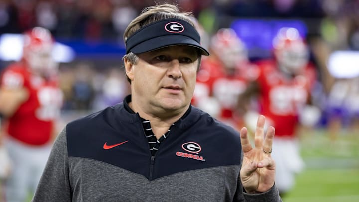 Jan 9, 2023; Inglewood, CA, USA; Georgia Bulldogs head coach Kirby Smart holds up three fingers against the TCU Horned Frogs during the CFP national championship game at SoFi Stadium. Mandatory Credit: Mark J. Rebilas-Imagn Images