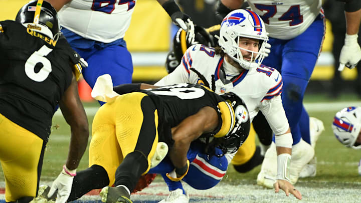 Nov 30, 2025; Pittsburgh, Pennsylvania, USA; Buffalo Bills quarterback Josh Allen (17) is sacked by Pittsburgh Steelers defensive tackle Derrick Harmon (99) during the second quarter at Acrisure Stadium. 