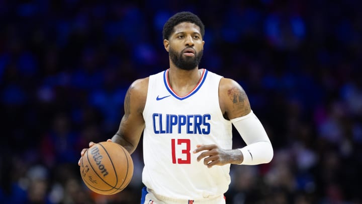 Mar 27, 2024; Philadelphia, Pennsylvania, USA; LA Clippers forward Paul George (13) dribbles the ball against the Philadelphia 76ers during the fourth quarter at Wells Fargo Center. Mandatory Credit: Bill Streicher-USA TODAY Sports