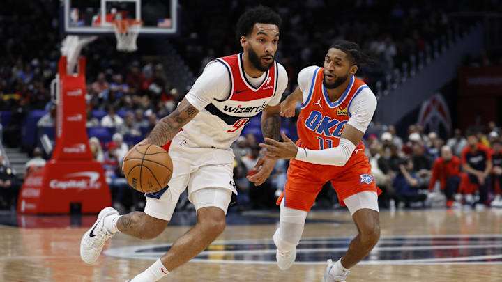 Jan 12, 2025; Washington, District of Columbia, USA; Washington Wizards forward Justin Champagnie (9) drives to the basket as Oklahoma City Thunder guard Isaiah Joe (11) defends in the second quarter at Capital One Arena. Mandatory Credit: Geoff Burke-Imagn Images