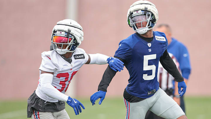 Jul 24, 2024; East Rutherford, NJ, USA; New York Giants wide receiver Allen Robinson II (5) is defended by New York Giants cornerback Kaleb Hayes (38) during training camp at Quest Diagnostics Training Facility. Mandatory Credit: Vincent Carchietta-Imagn Images