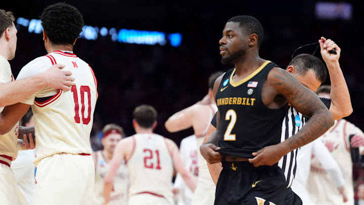 Vanderbilt's Duke Miles (2) walks off the court as Nebraska celebrates following a second-round game in the NCAA men's basketball tournament between Nebraska Cornhuskers and Vanderbilt Commodores at Paycom Center in Oklahoma City, Saturday March 21, 2026. Vanderbilt's Duke Miles (2) walks off the court as Nebraska celebrates following a second-round game in the NCAA men's basketball tournament between Nebraska Cornhuskers and Vanderbilt Commodores at Paycom Center in Oklahoma City, Saturday March 21, 2026.