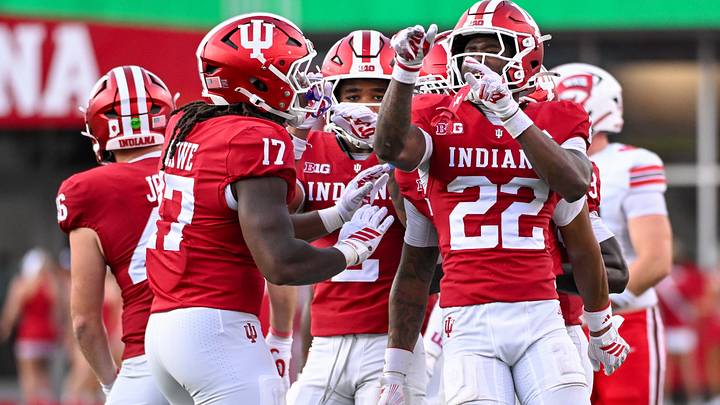 Sep 19, 2026; Bloomington, Indiana, USA; Indiana Hoosiers defensive lineman Daniel Ndukwe (17) and Indiana Hoosiers defensive back Jamari Sharpe (22) celebrate after a play against the Western Kentucky Hilltoppers during the second half at Merchants Bank Field at Memorial Stadium. Mandatory Credit: Robert Goddin-Imagn Images