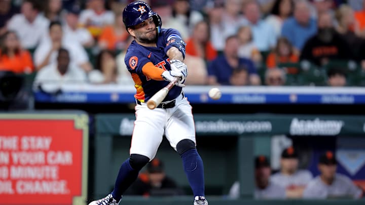 Apr 2, 2025; Houston, Texas, USA; Houston Astros designated hitter Jose Altuve (27) hits a single against the San Francisco Giants during the sixth inning at Daikin Park.