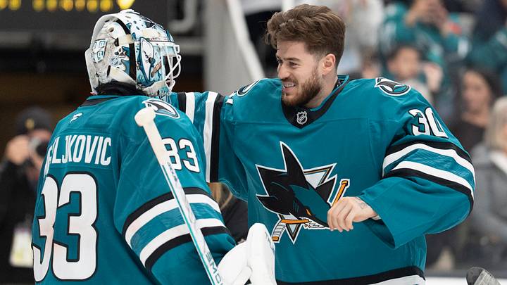 Apr 2, 2026; San Jose, California, USA;  San Jose Sharks goaltenders Alex Nedeljkovic (33) and Yaroslav Askarov (30) celebrate after defeating the Toronto Maple Leafs at SAP Center at San Jose. Mandatory Credit: Stan Szeto-Imagn Images