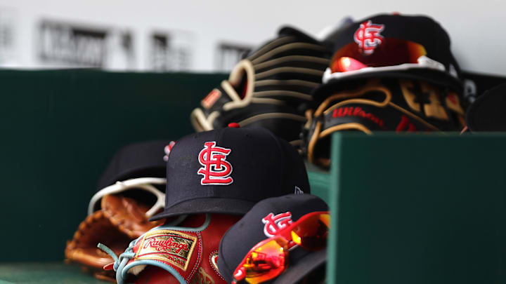 Apr 24, 2022; Cincinnati, Ohio, USA; A view of St. Louis Cardinals players hats and gloves in the dugout during a game with the Cincinnati Reds at Great American Ball Park. Mandatory Credit: David Kohl-Imagn Images Apr 24, 2022; Cincinnati, Ohio, USA; A view of St. Louis Cardinals players hats and gloves in the dugout during a game with the Cincinnati Reds at Great American Ball Park. Mandatory Credit: David Kohl-Imagn Images