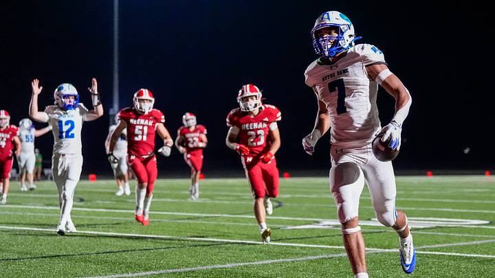Green Bay Notre Dame's Kingston Allen (7) scores a touchdown against Neenah High School on Friday, Aug. 21, 2026, at Neenah High School in Neenah, Wisconsin. Notre Dame won the game in overtime, 56-53.
Tork Mason/Green Bay Press-Gazette
