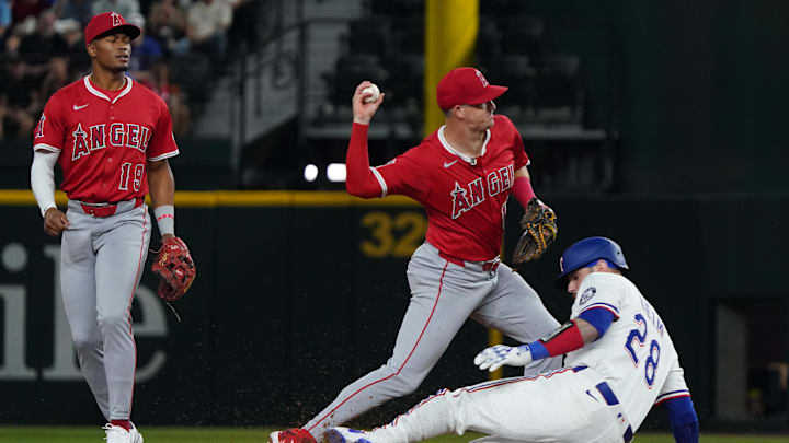 Apr 16, 2025; Arlington, Texas, USA; Texas Rangers catcher Jonah Heim (28) is forced out at second base by Los Angeles Angels shortstop Kevin Newman (10) during the second inning at Globe Life Field. Mandatory Credit: Raymond Carlin III-Imagn Images Apr 16, 2025; Arlington, Texas, USA; Texas Rangers catcher Jonah Heim (28) is forced out at second base by Los Angeles Angels shortstop Kevin Newman (10) during the second inning at Globe Life Field. Mandatory Credit: Raymond Carlin III-Imagn Images