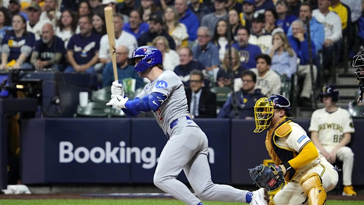 Oct 11, 2025; Milwaukee, Wisconsin, USA; Chicago Cubs second baseman Nico Hoerner (2) hits a single against the Milwaukee Brewers in the third inning during game five of the NLDS round for the 2025 MLB playoffs at American Family Field. Mandatory Credit: Michael McLoone-Imagn Images