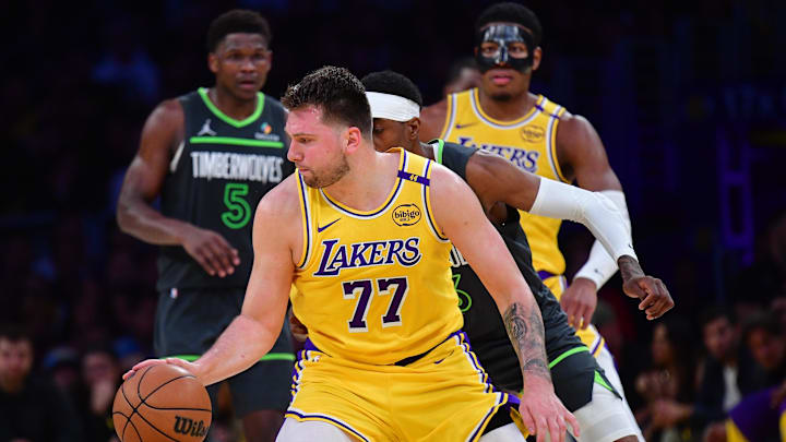 Apr 30, 2025; Los Angeles, California, USA: Los Angeles Lakers guard Luka Doncic (77) controls the ball against the Minnesota Timberwolves during the second half in game five of first round for the 2025 NBA Playoffs at Crypto.com Arena. Mandatory Credit: Gary A. Vasquez-Imagn Images Apr 30, 2025; Los Angeles, California, USA: Los Angeles Lakers guard Luka Doncic (77) controls the ball against the Minnesota Timberwolves during the second half in game five of first round for the 2025 NBA Playoffs at Crypto.com Arena. Mandatory Credit: Gary A. Vasquez-Imagn Images