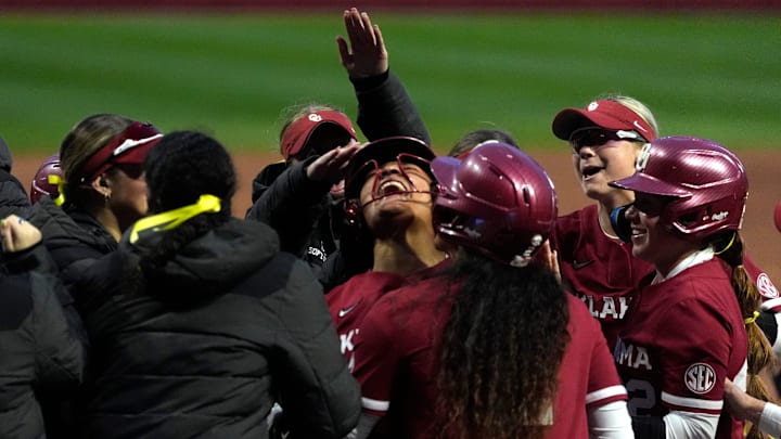 Oklahoma's Ella Parker celebrates a grand slam in the third inning. Oklahoma's Ella Parker celebrates a grand slam in the third inning.