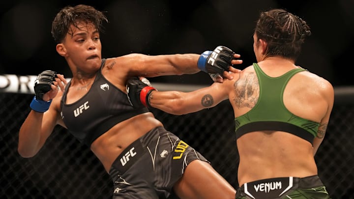 Aug 13, 2022; San Diego, California, USA; Yazmin Jauregui (red gloves) fights against Iasmin Lucindo