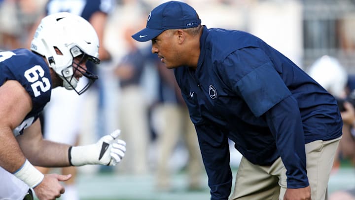 Penn State Nittany Lions running backs coach Ja'Juan Seider talks with a player during warm-ups prior to a football game at Beaver Stadium. Penn State Nittany Lions running backs coach Ja'Juan Seider talks with a player during warm-ups prior to a football game at Beaver Stadium.